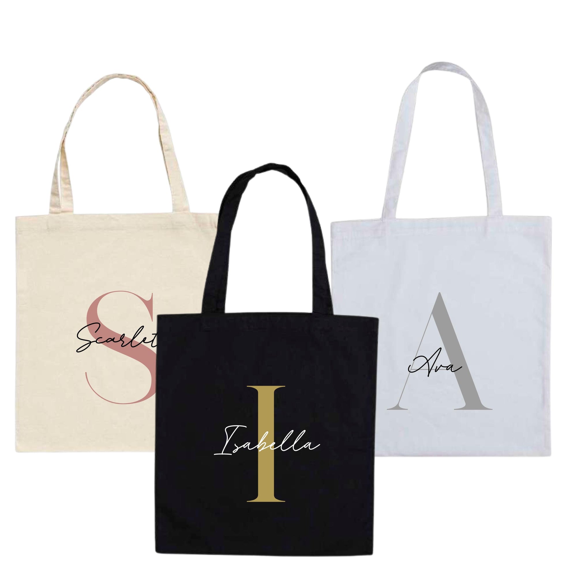 Set of three personalised cotton tote bags in black, white, and natural – names Scarlett, Ava, and Isabella with large initials S, A, I.