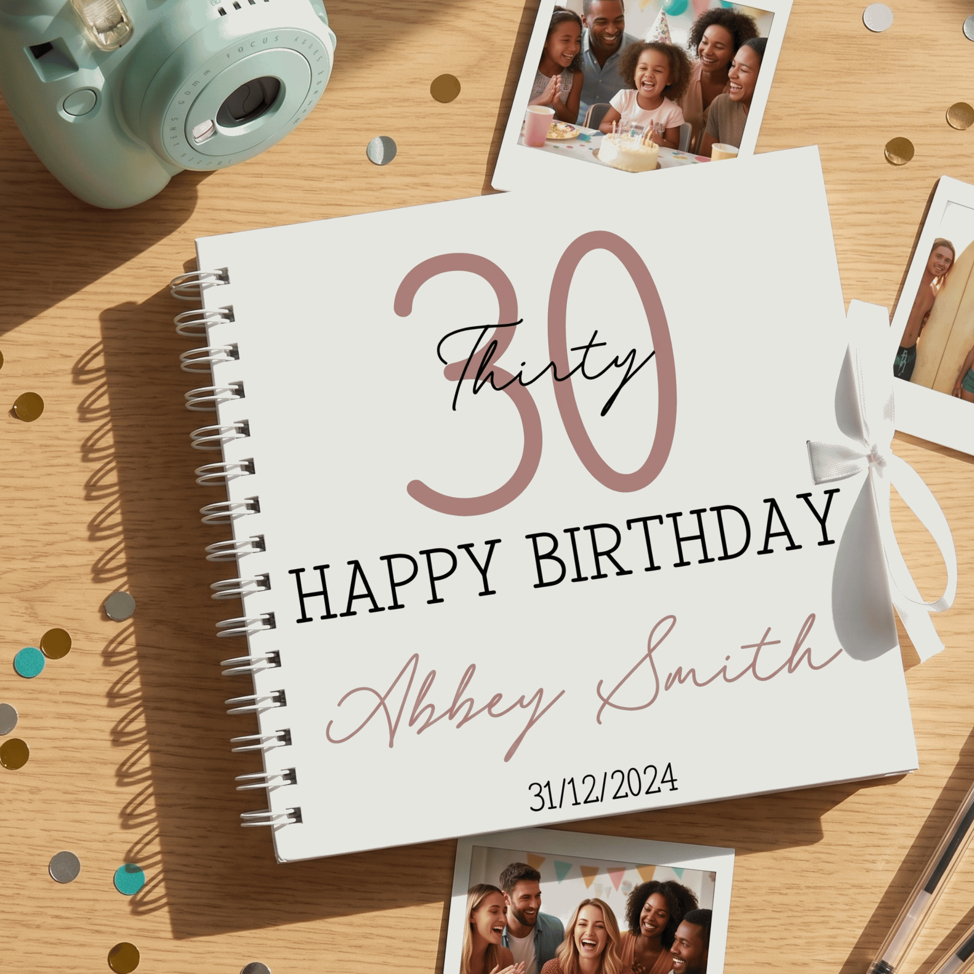 Personalised birthday album with '30 Happy Birthday Abbey Smith' on a wooden surface with photos and a camera.