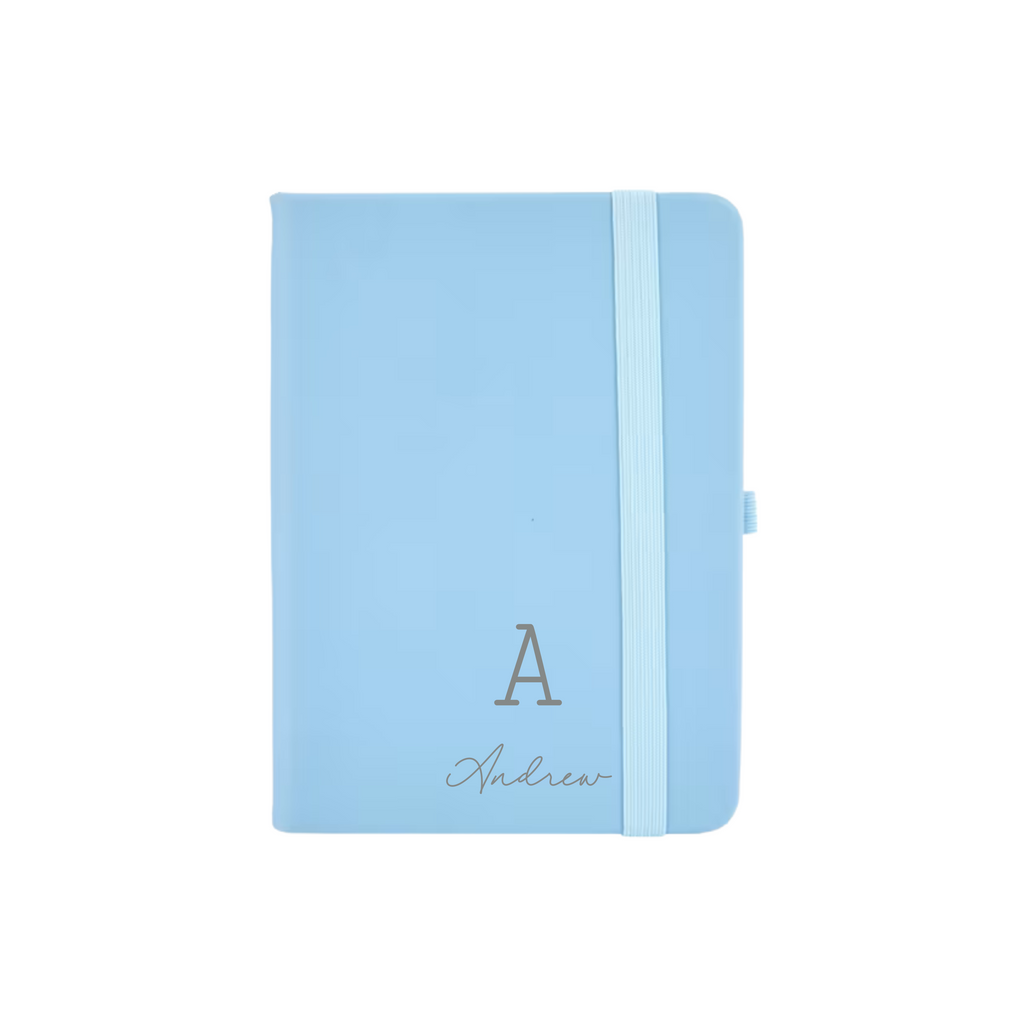 Light blue personalised A6 vegan leather notebook with initial A and name Andrew printed on the cover.
