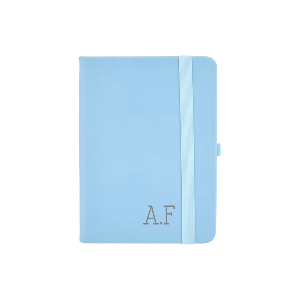 Personalised blue vegan leather A6 notebook featuring initials A.F printed in grey on the cover.