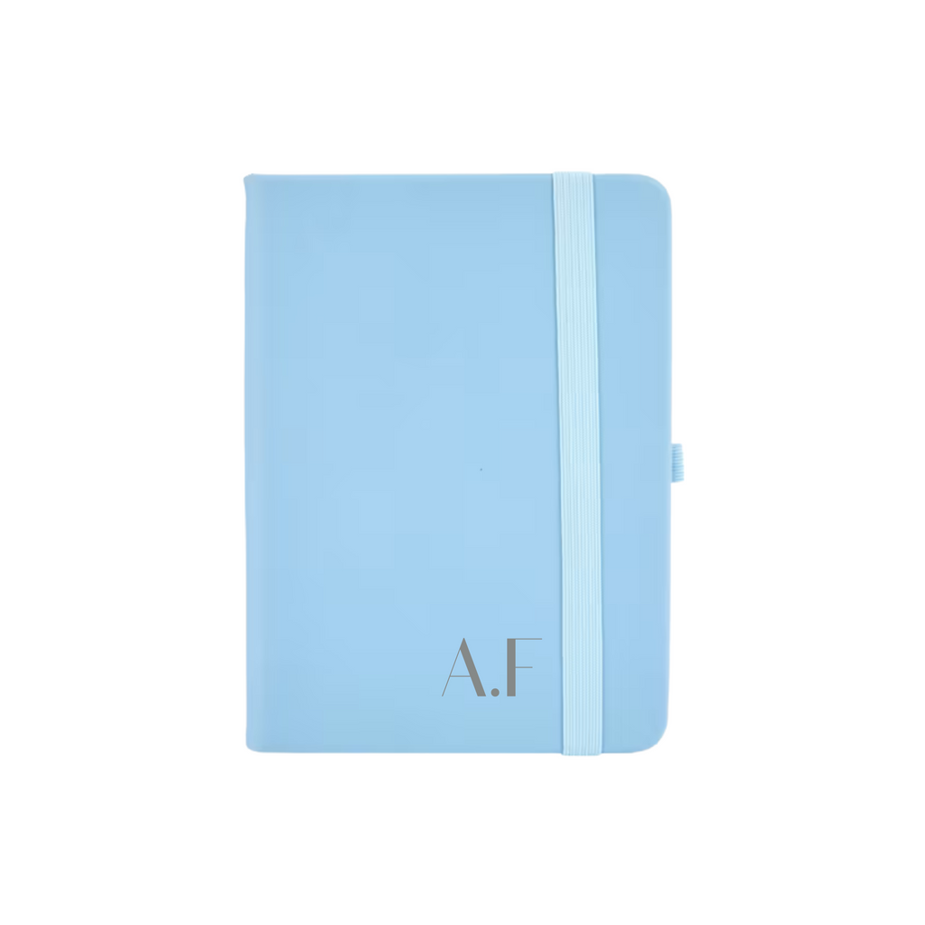 Personalised blue vegan leather A6 notebook featuring initials A.F printed in grey on the cover.