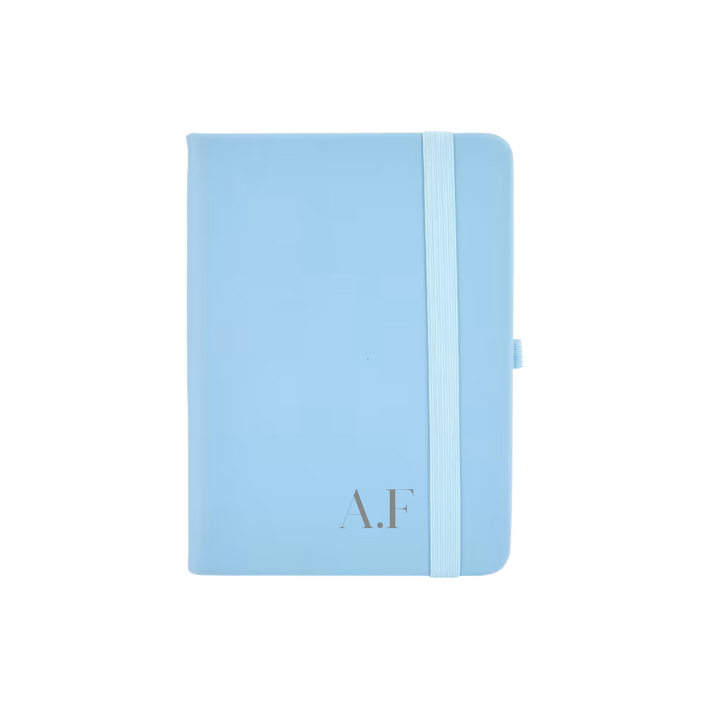 Personalised blue vegan leather A6 notebook featuring initials A.F printed in grey on the cover.