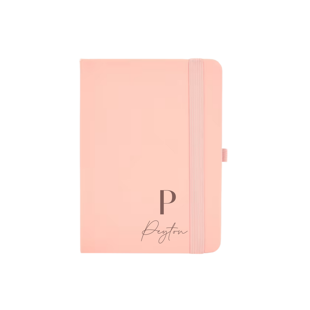 Peach A6 vegan leather notebook personalised with initial P and name Peyton in elegant font.