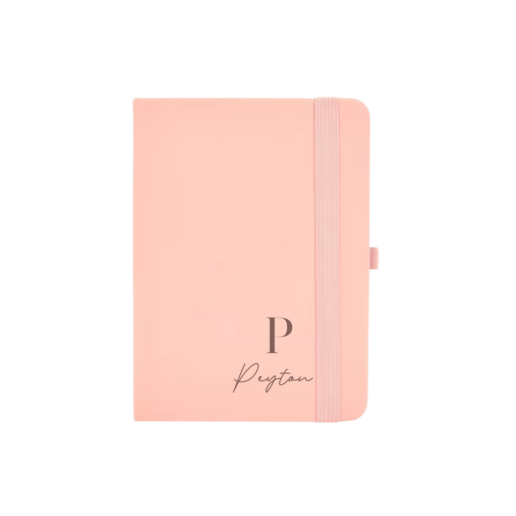 Peach A6 vegan leather notebook personalised with initial P and name Peyton in elegant font.