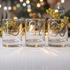Three personalized glasses with numbers and names on a festive background