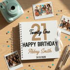 Personalised birthday album with photos and a camera on a wooden surface