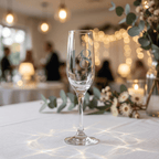 Champagne flute with '18' engraving on a table with blurred background