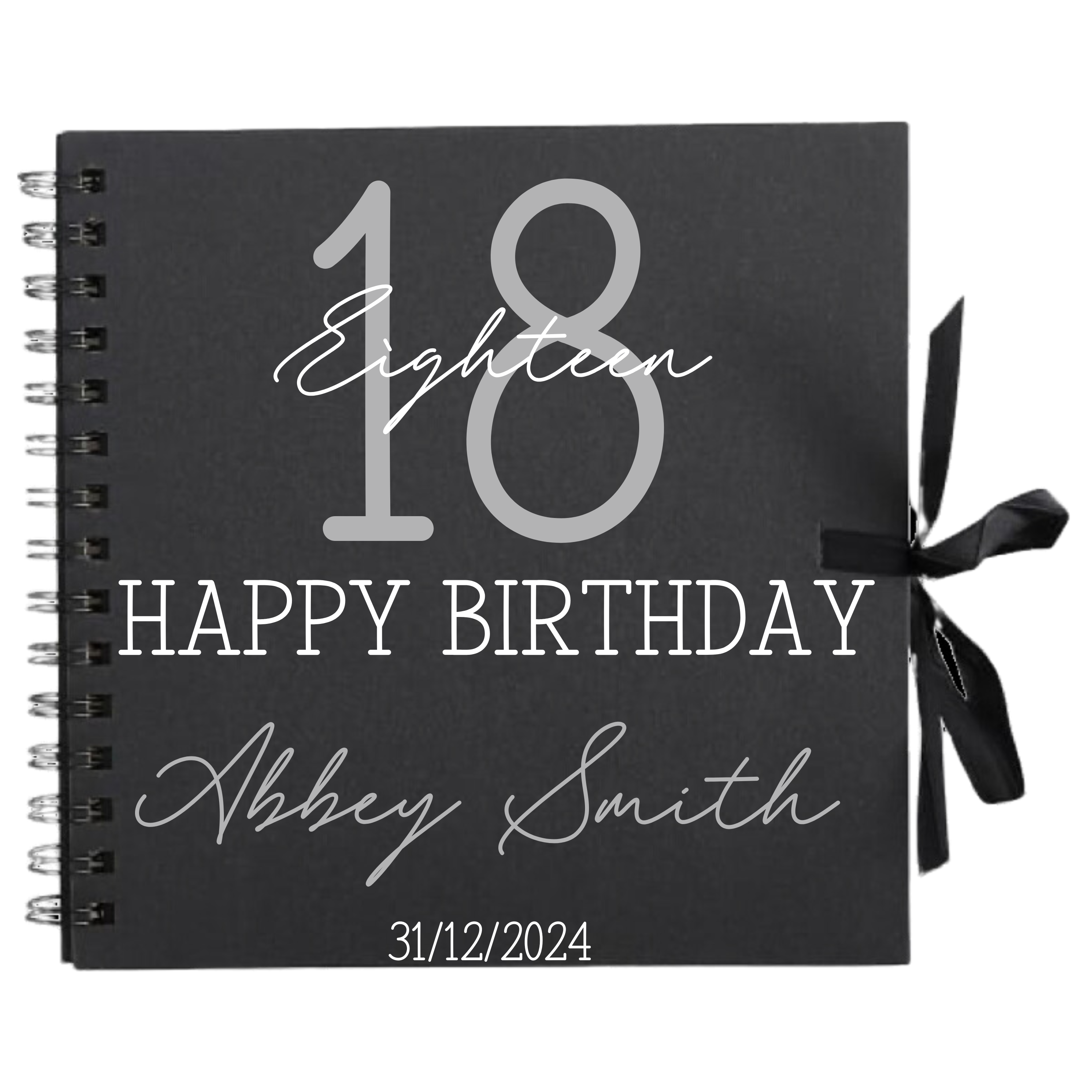 Close-up of 18th birthday personalised scrapbook album in black with ribbon tie, name and date on cover