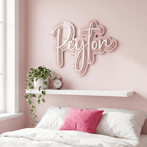 A custom 3D triple layered acrylic name plaque featuring raised lettering mounted on a nursery feature wall, handcrafted by Make It Personal Gift Co in Central Coast, Australia.