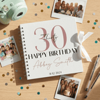 Personalised birthday Album with photos and confetti on a wooden surface