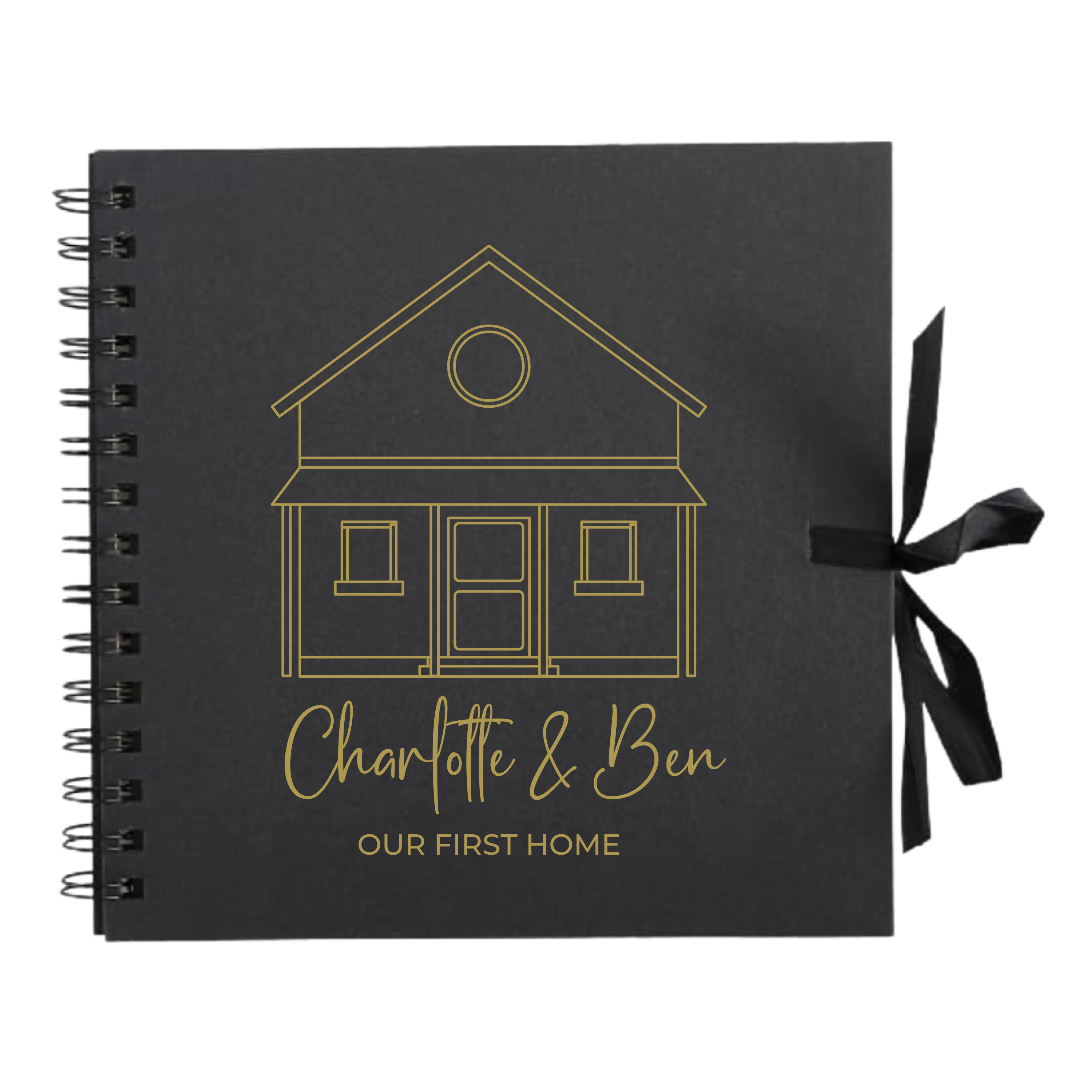 Black scrapbook album with gold house outline and text "Our First Home", ribbon-tied spine