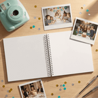 Open Album with polaroid photos and a mint green camera on a wooden surface with confetti.