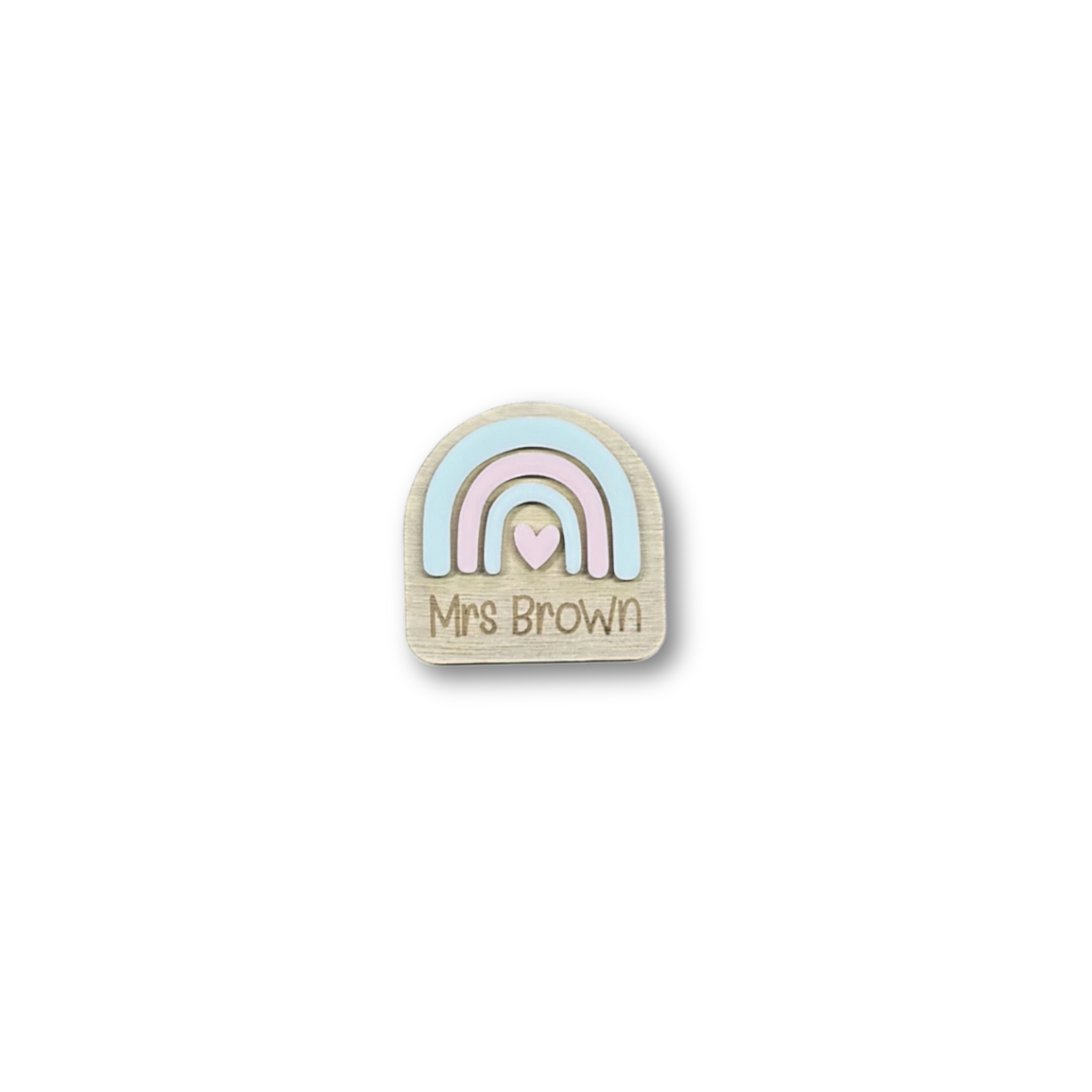 Close-up of custom rainbow name badge engraved with Mrs Brown