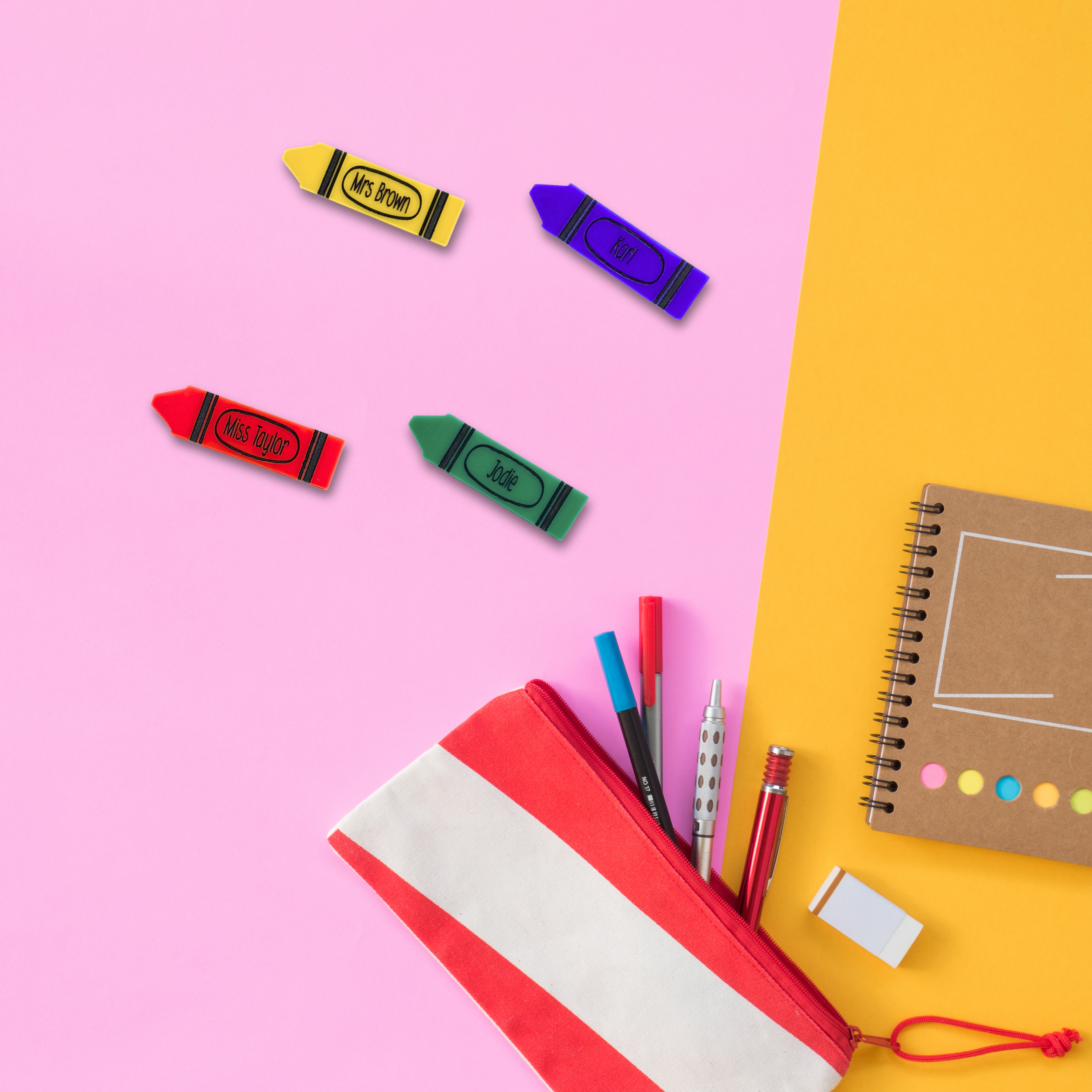 Crayon-shaped personalised name badges on colourful stationery background