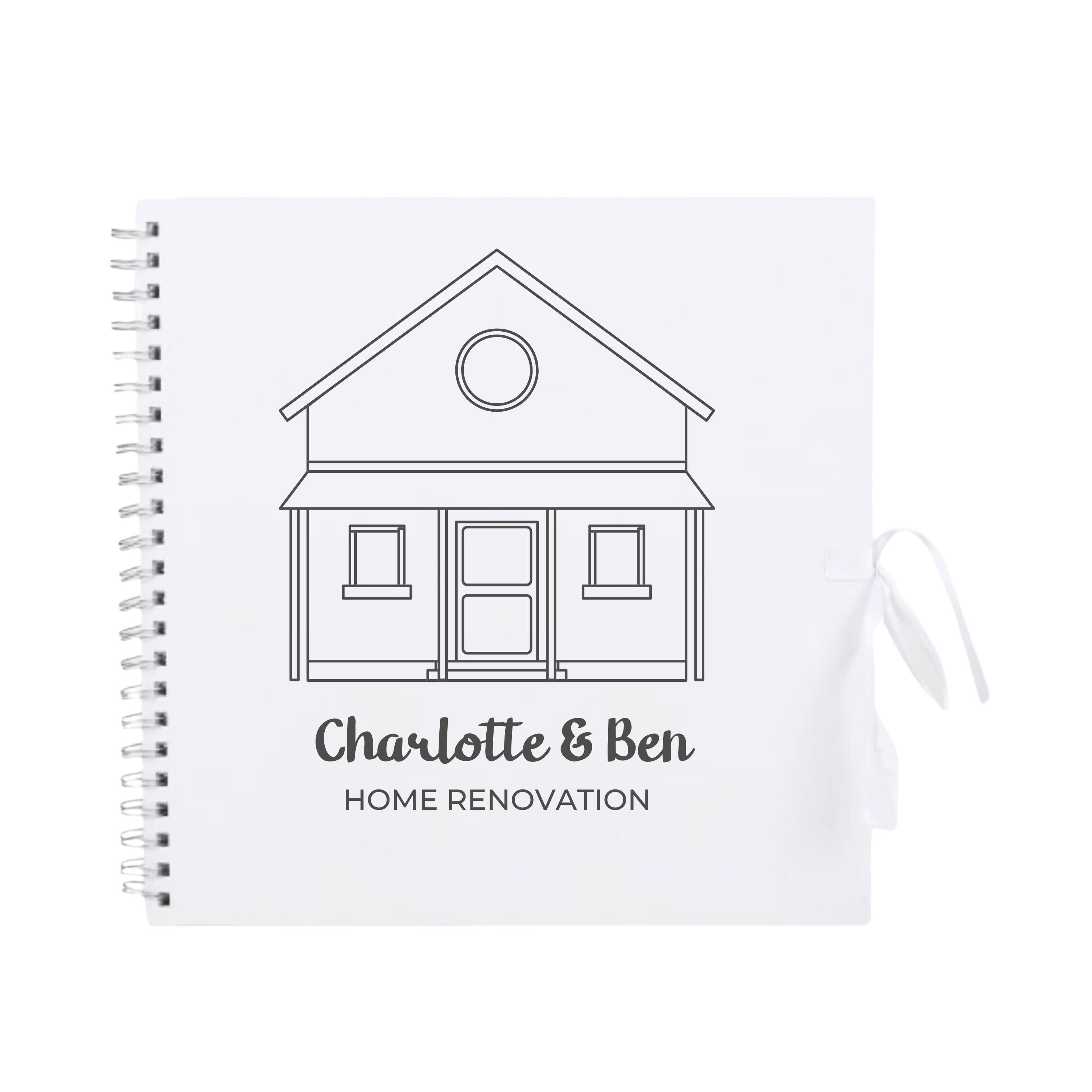 White scrapbook album with black outline and custom text "Home Renovation", tied with white ribbon