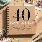 Personalised birthday Album with '40 Happy Birthday Abbey Smith' on a wooden surface with photos and stationery.