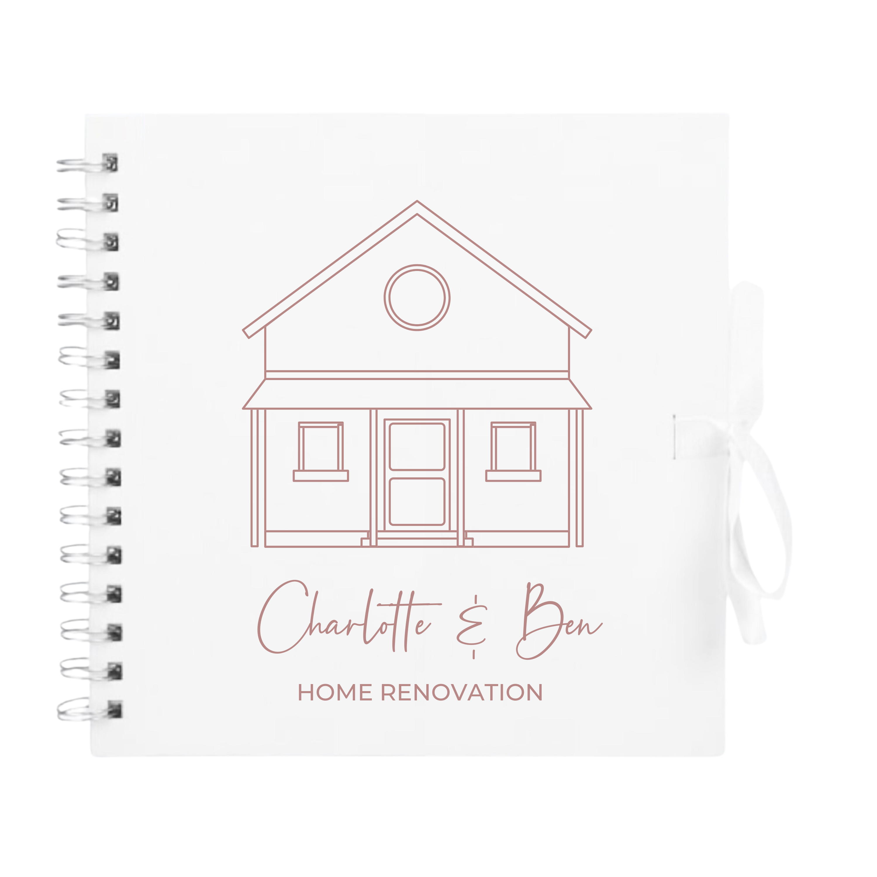 White scrapbook album with rose gold outline and custom text "Home Renovation", tied with white ribbon