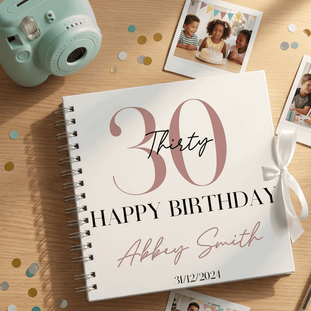 Personalised birthday Album with '30 Happy Birthday' design on a wooden surface with confetti and a camera.