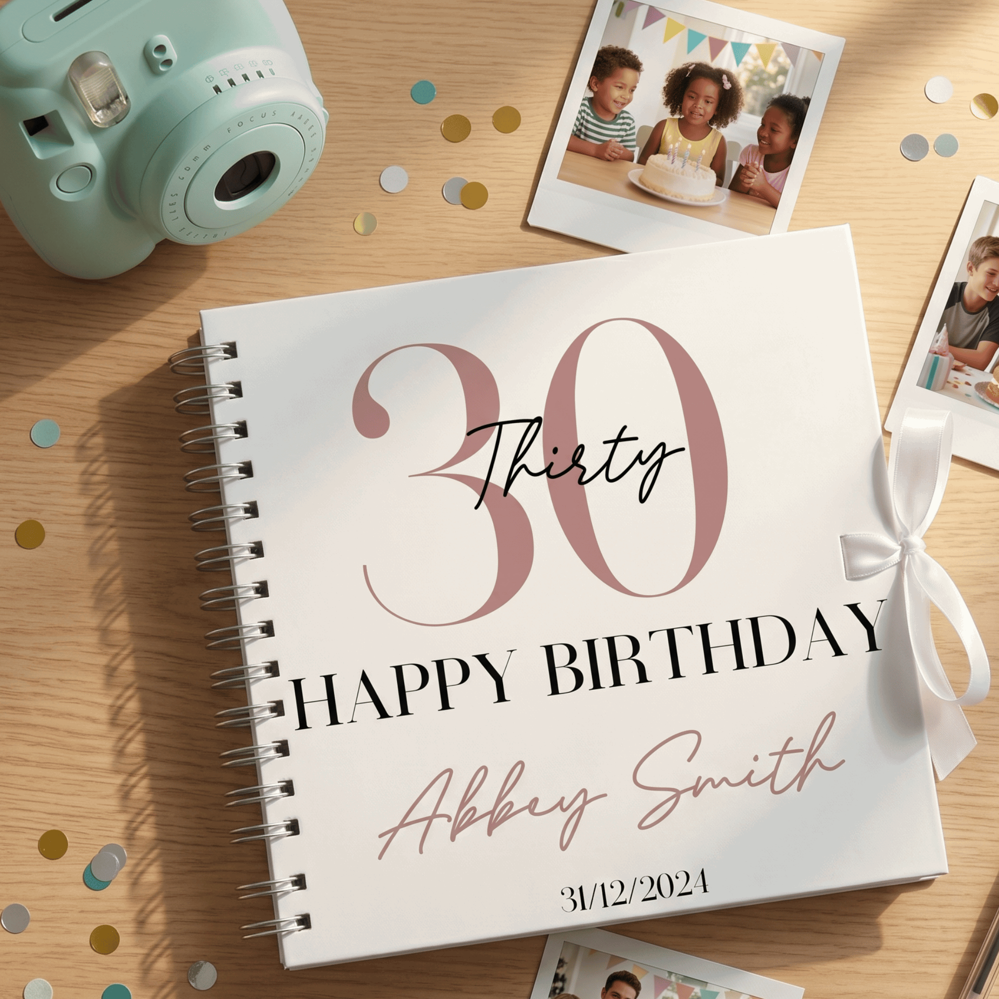 Personalised birthday Album with '30 Happy Birthday' design on a wooden surface with confetti and a camera.
