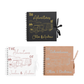 Three personalised caravan scrapbook albums in black, white, and kraft brown covers, featuring custom names and vehicle illustrations. Ideal travel journals.