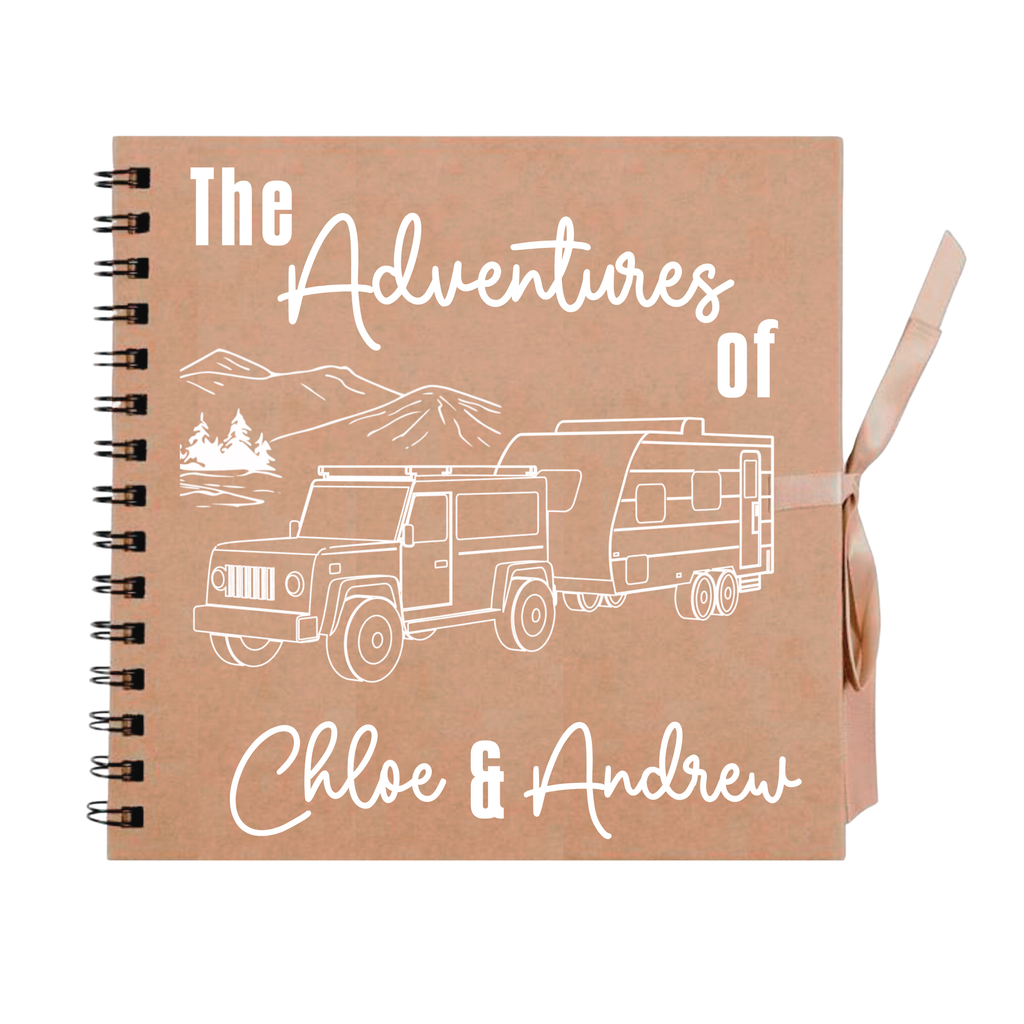  Kraft brown scrapbook album with white illustration and “The Adventures of Chloe & Andrew” – handmade travel photo album for couples.
