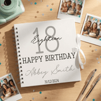 Birthday album with '18 Happy Birthday Abbey Smith' on a wooden surface with photos and stationery.