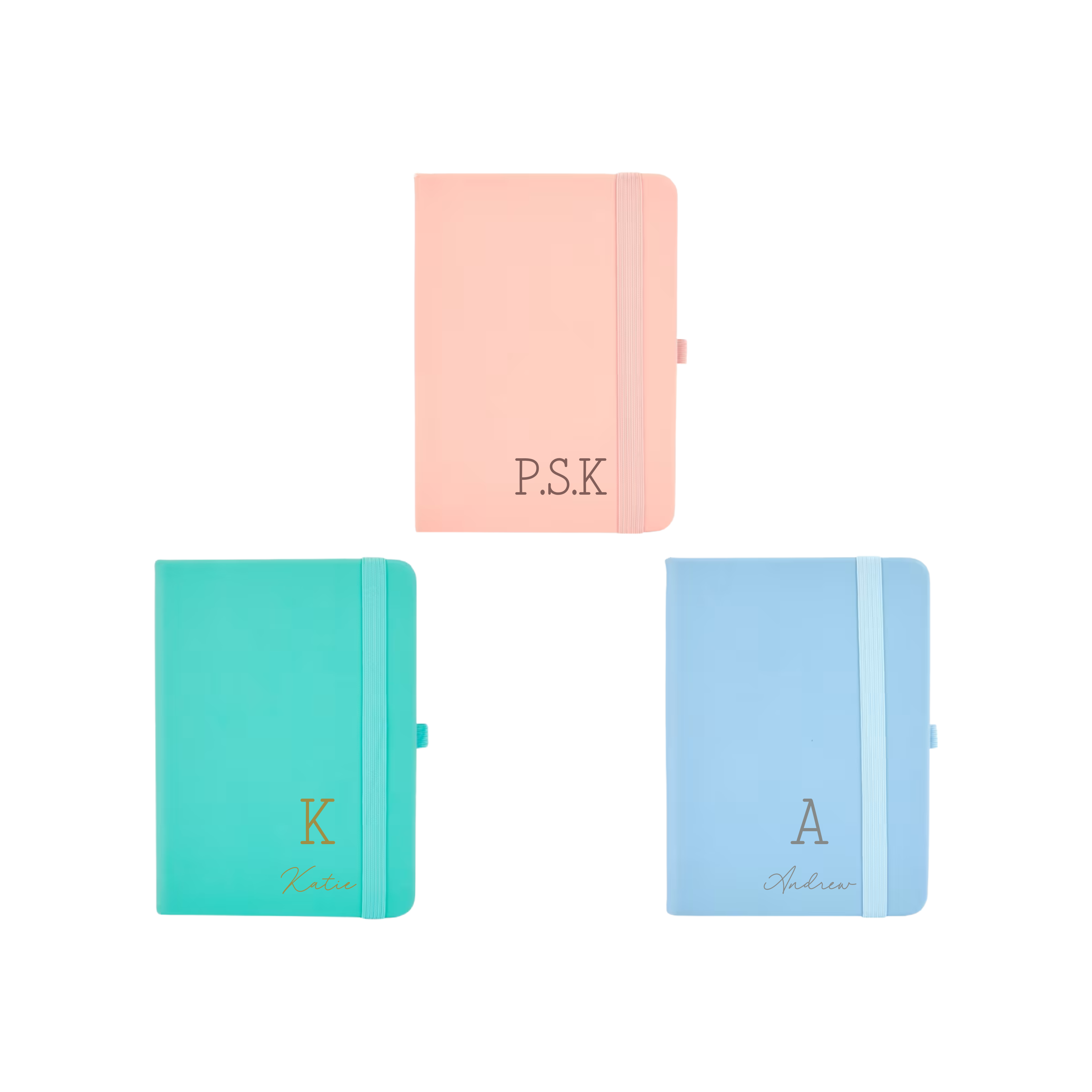 Flat lay of three personalised A6 vegan leather notebooks in pastel peach, teal, and blue colours with custom initials and names on covers.