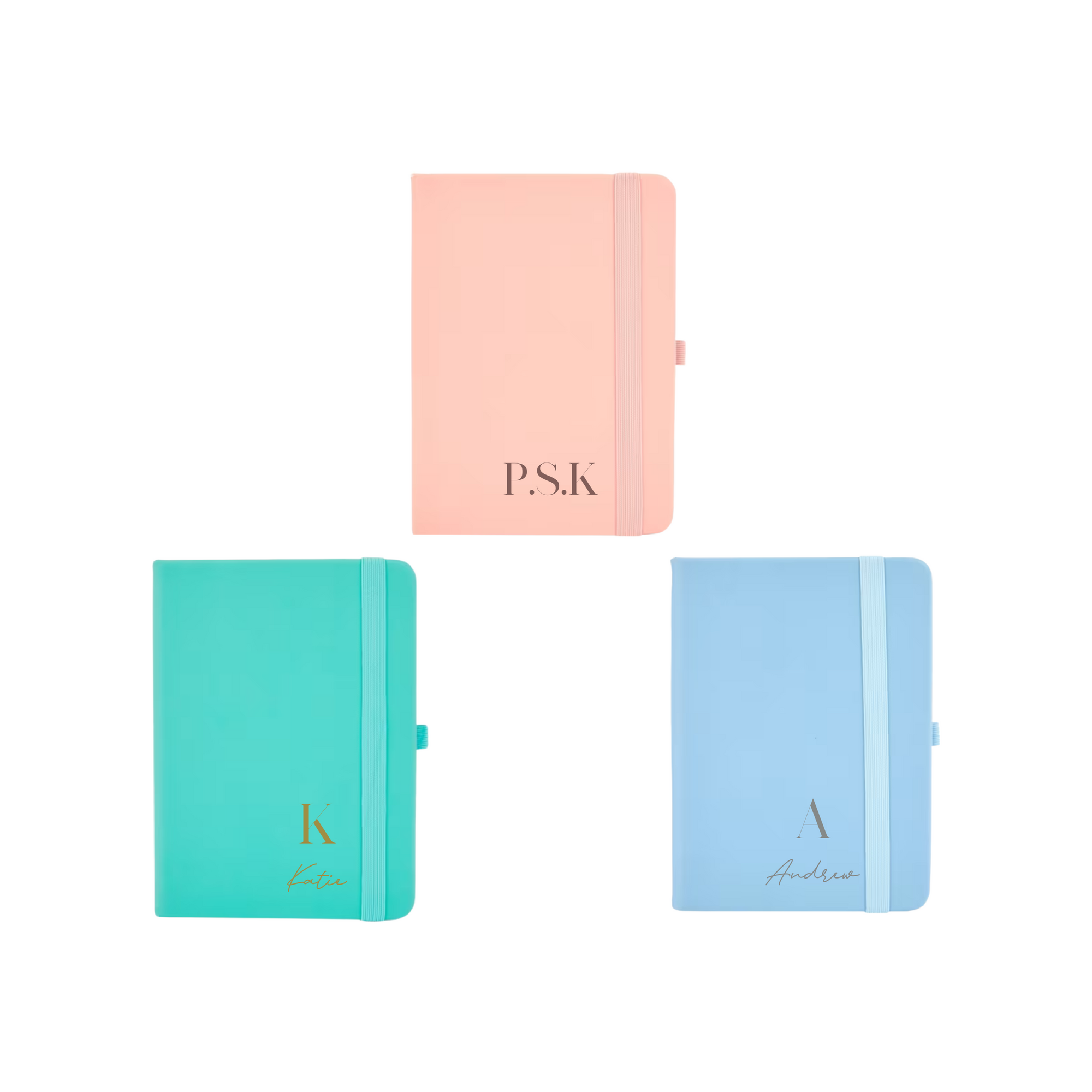 Flat lay of three personalised A6 vegan leather notebooks in pastel peach, teal, and blue colours with custom initials and names on covers