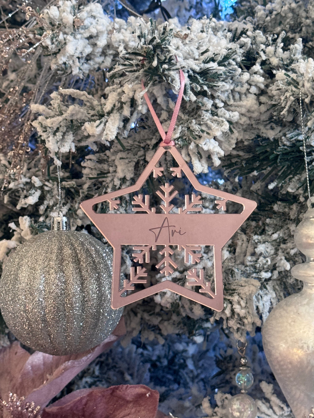 Custom engraved star ornament featuring family names and date