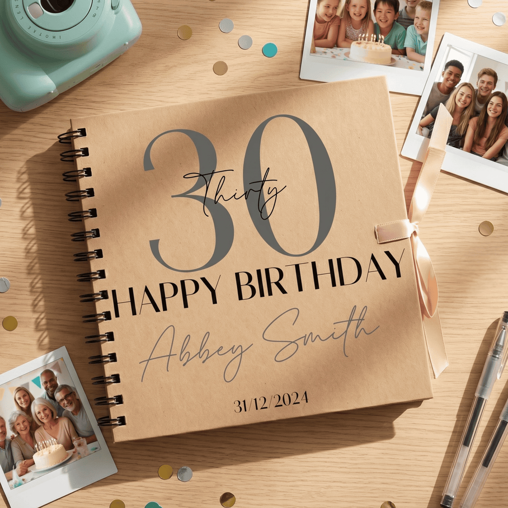 Personalised birthday Album with photos and stationery on a wooden surface