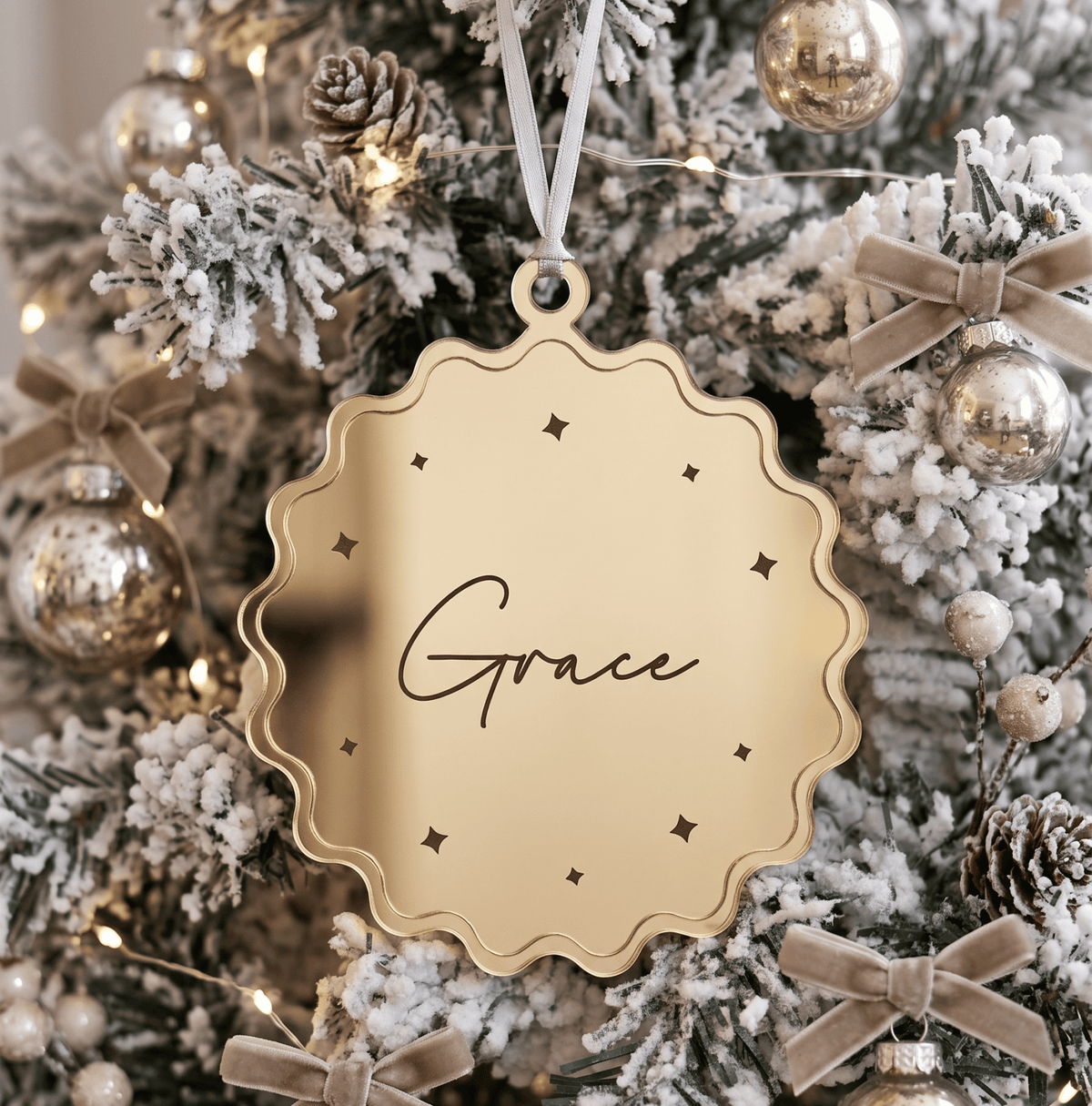 Double layer personalised christmas ornament featuring natural birch timber and acrylic details hanging on a festive Christmas tree