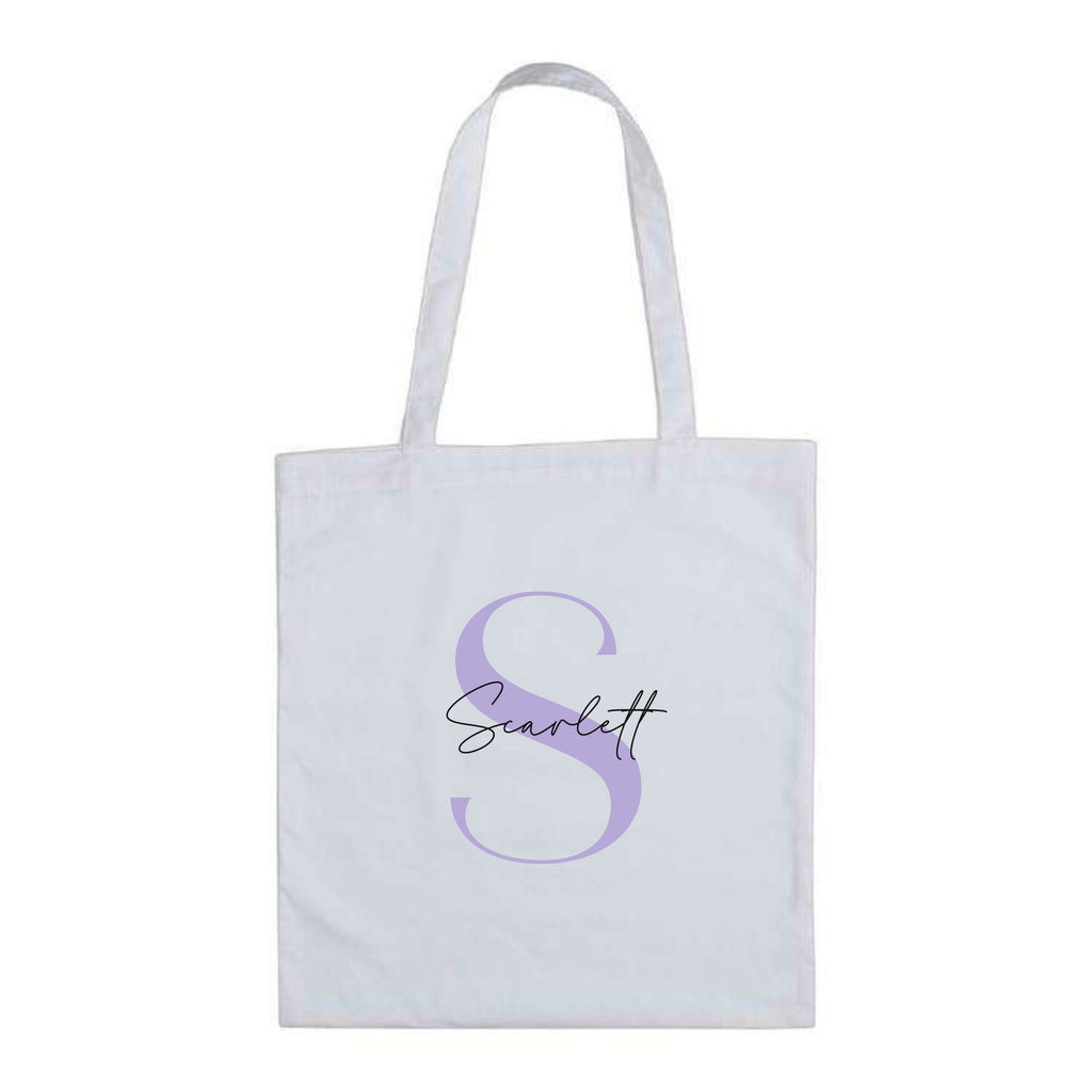 White cotton tote bag with lilac letter S and the name "Scarlett" – custom reusable personalised initial tote bag.