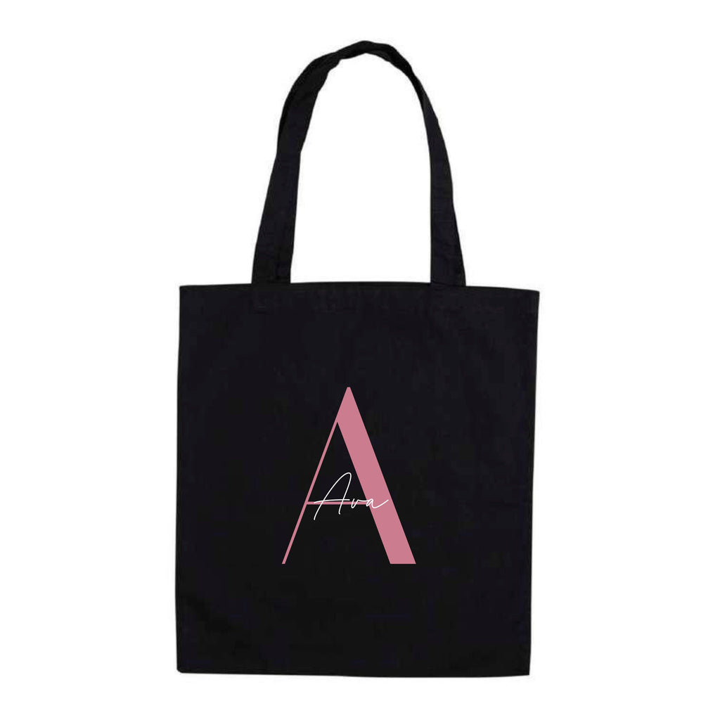 Black cotton tote bag featuring personalised design with pink letter A and the name "Ava" – reusable name tote bag.