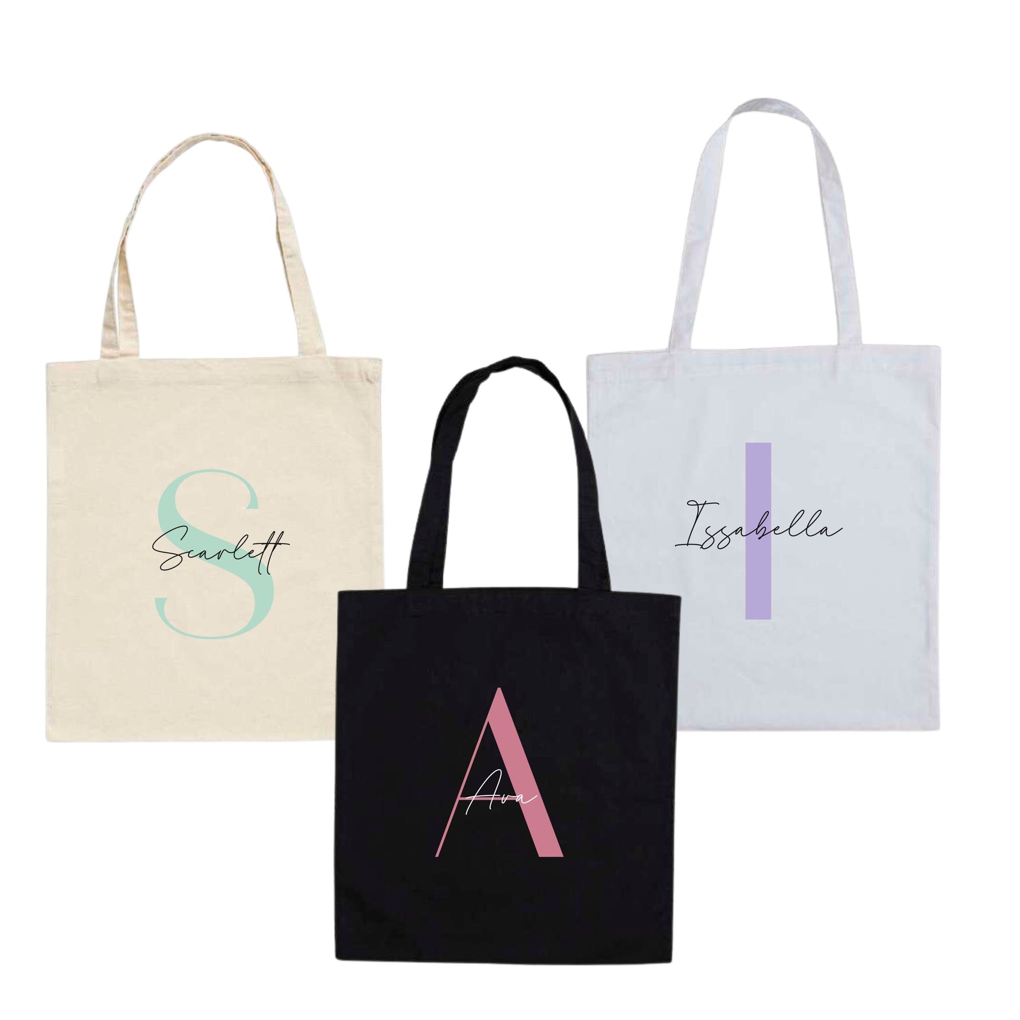 Set of three personalised cotton tote bags in black, white, and natural – names Scarlett, Ava, and Isabella with large initials S, A, I.