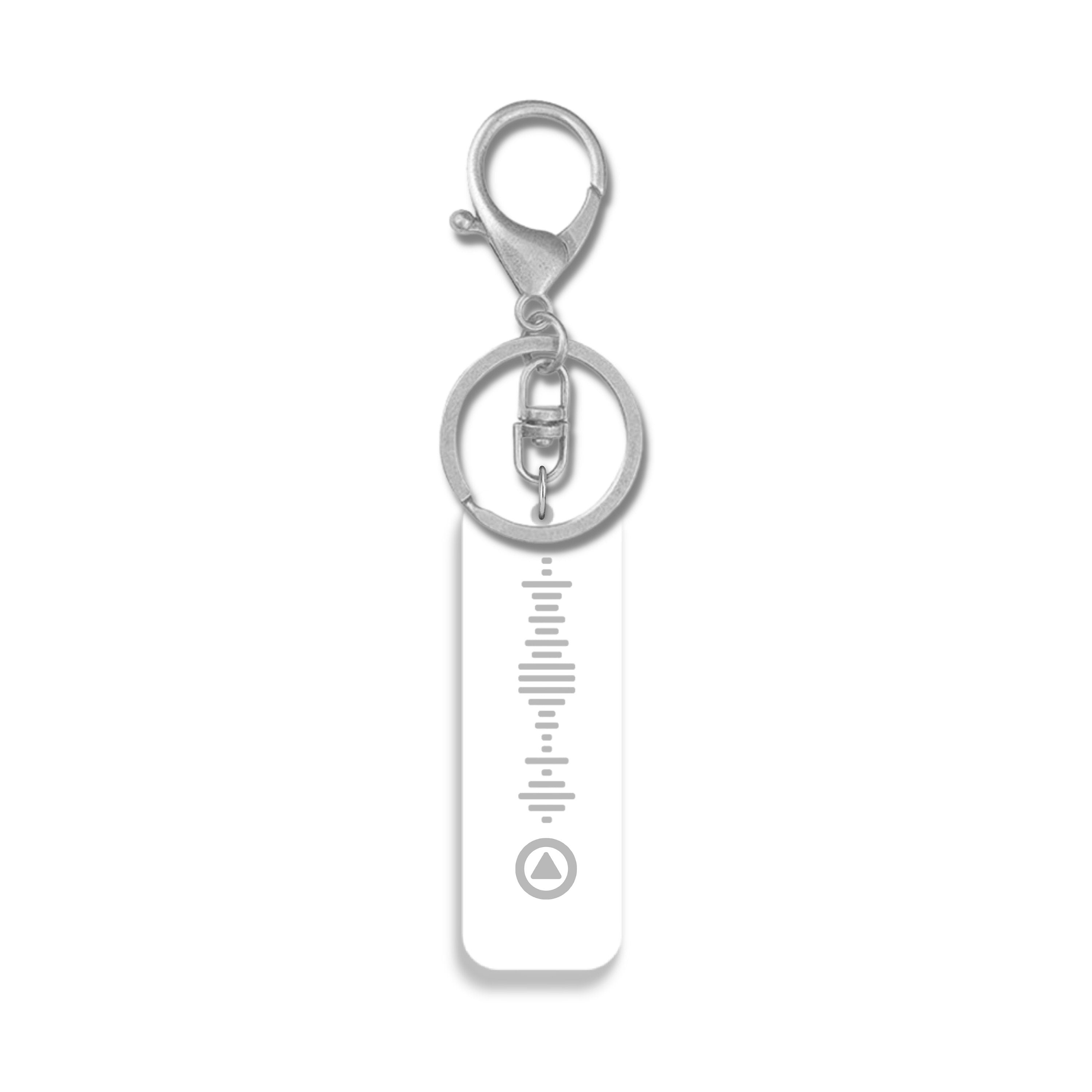 White acrylic Spotify code keyring with silver hardware – scannable personalised music gift for her or him.