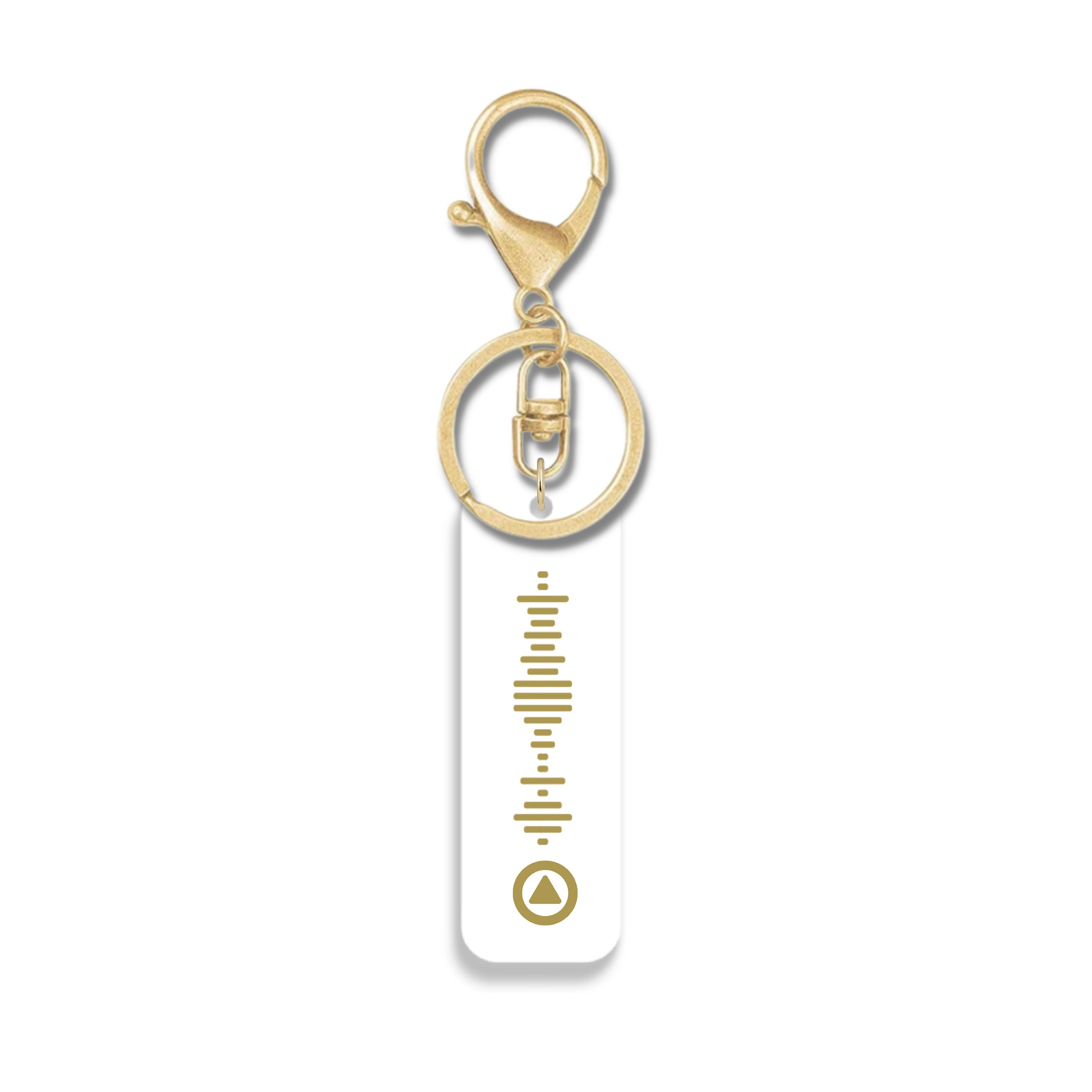 White acrylic keychain with engraved Spotify-style QR code in gold and matching gold keyring hardware – thoughtful music gift idea. 