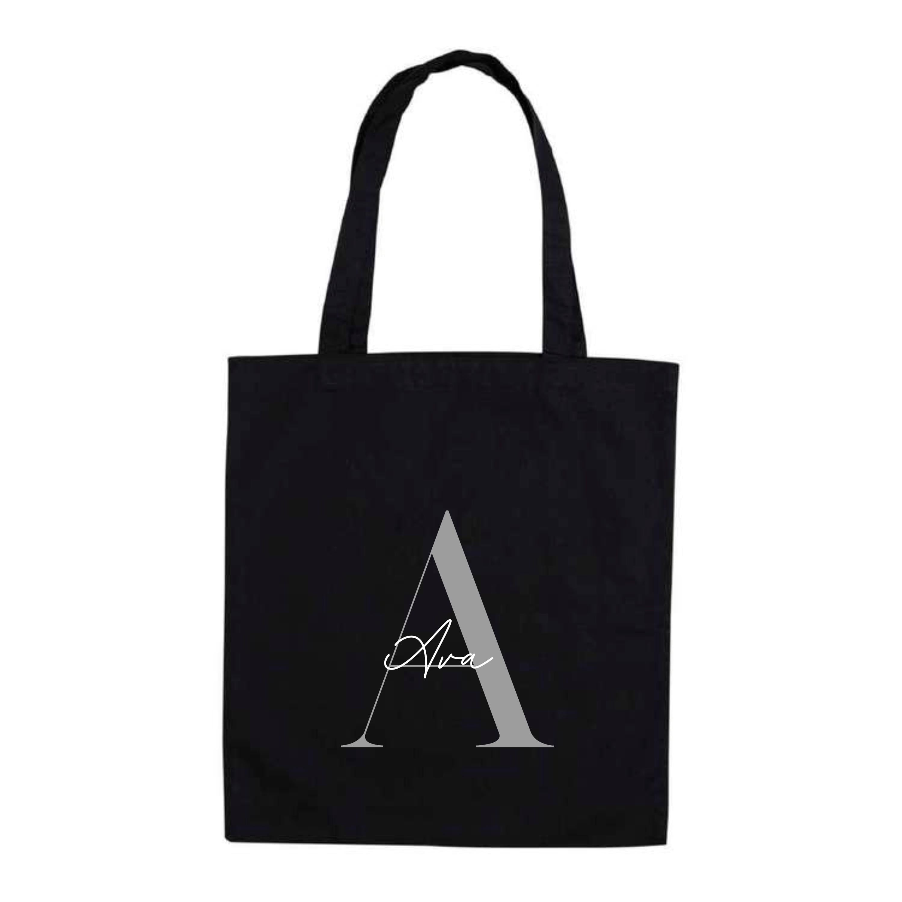 Black cotton tote bag featuring personalised design with silver letter A and the name "Ava" – reusable name tote bag.