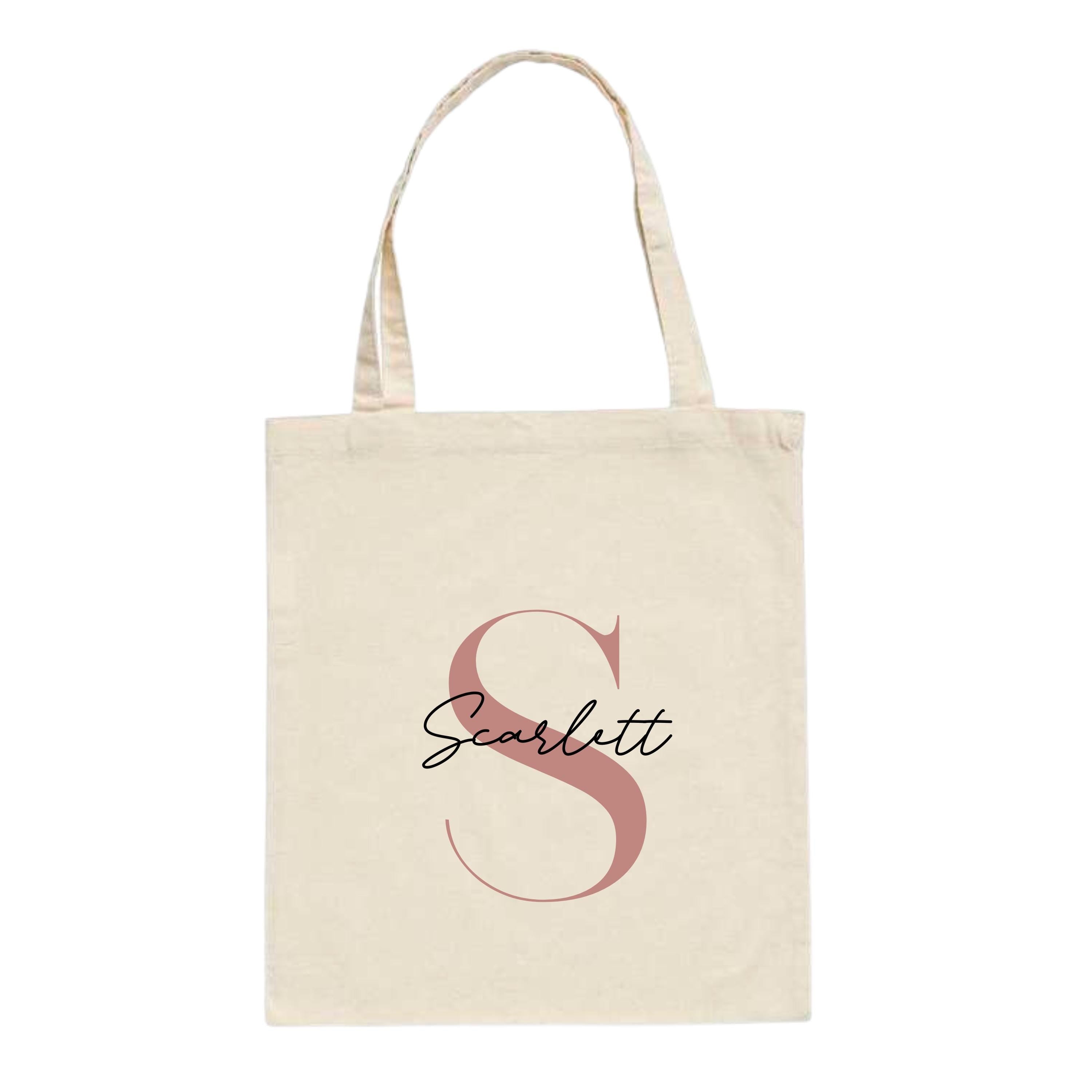 Natural cotton tote bag with custom name "Scarlett" and large rose gold letter S printed on front – personalised initial tote bag gift.