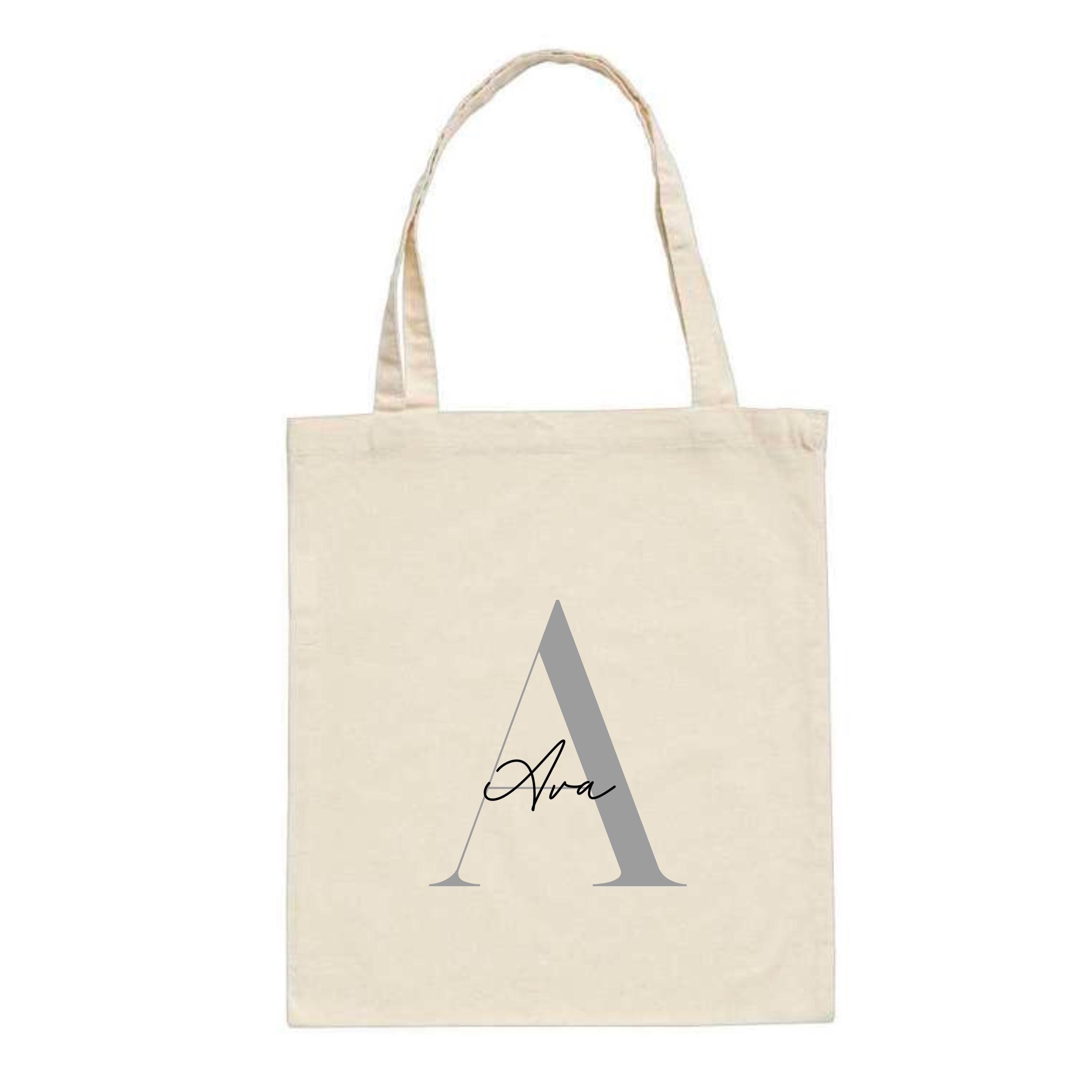 Personalised natural tote bag featuring the name "Ava" over a large silver letter A – custom initial cotton bag for her.