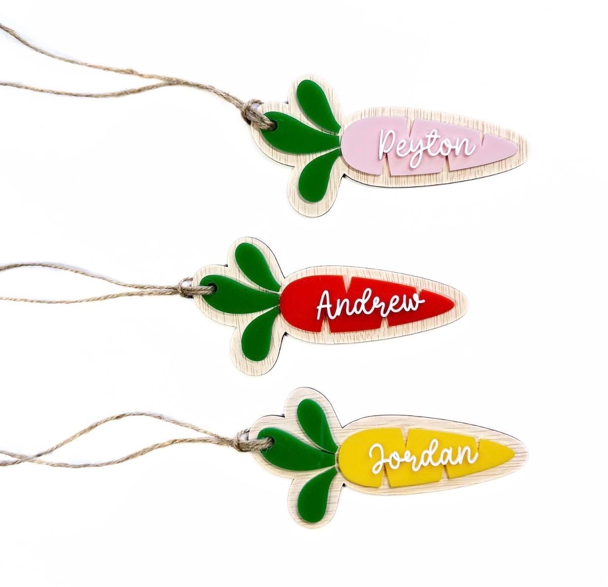 Set of three personalised carrot-shaped Easter name tags in pink, red, and yellow – custom acrylic Easter basket tags with names Peyton, Andrew, and Jordan