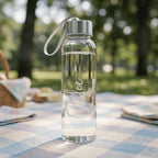 Reusable personalised glass water bottle named "Chloe," featuring a minimalist engraved name design, ideal for summer picnics and outdoor wedding guest gifts.