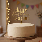 Bespoke Happy Birthday Jordan gold mirror acrylic cake topper showing fine script lettering.
