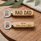 Personalised solid wood bottle opener with custom Father's Day laser engraving resting on natural timber tabletop.