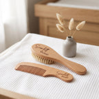 Personalised engraved wooden baby brush and comb set with custom name on white nursery blanket with natural dried bunny tails
