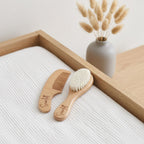 Personalised engraved wooden baby brush and comb set with custom name on white nursery blanket with natural dried bunny tails