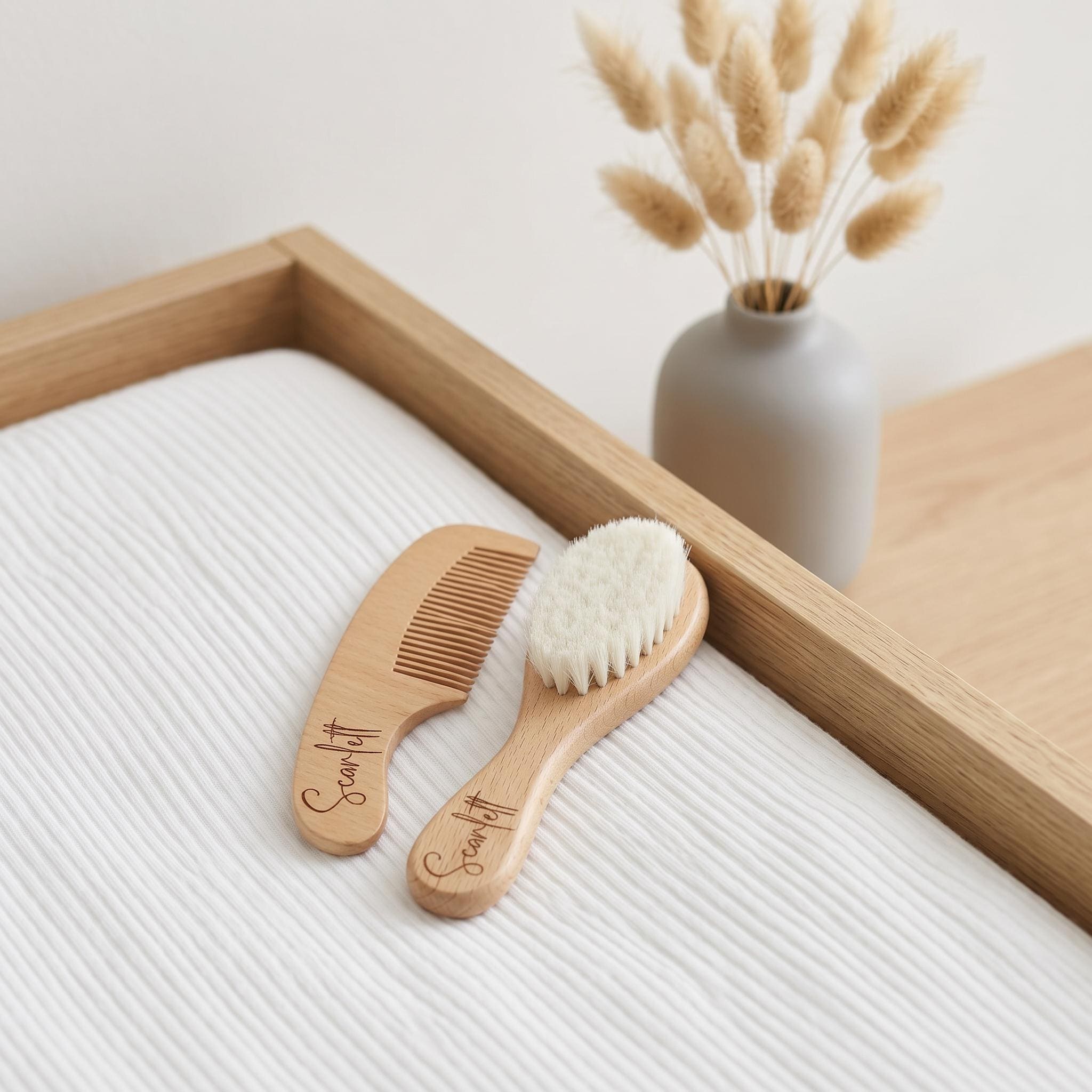 Personalised engraved wooden baby brush and comb set with custom name on white nursery blanket with natural dried bunny tails