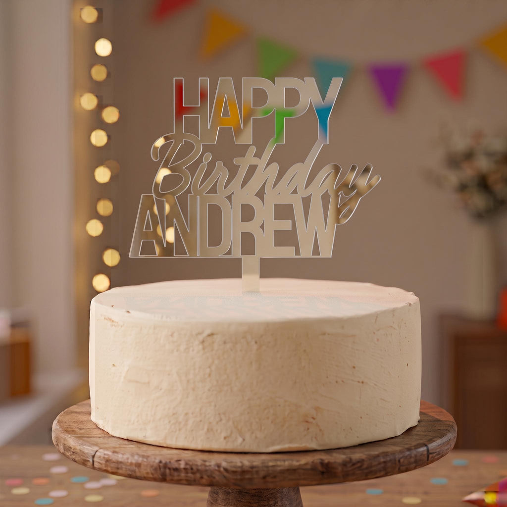 Custom Happy Birthday Andrew silver mirror acrylic cake topper positioned on a celebration cake.