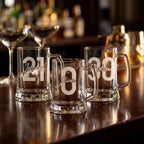 Personalised glass beer mug engraved with a custom name and milestone number, custom beer stein for birthdays and groomsmen gifts