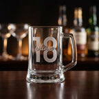 Personalised glass beer mug engraved with a custom name and milestone number, custom beer stein for birthdays and groomsmen gifts