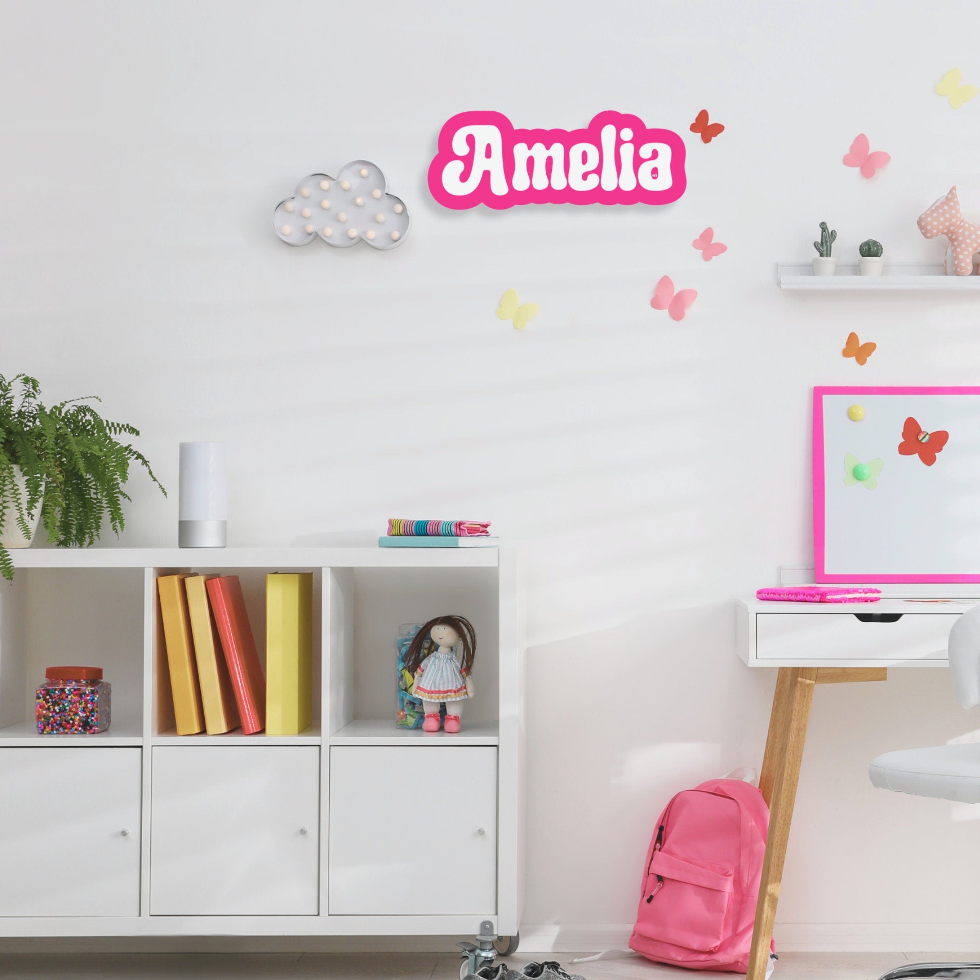 Custom acrylic kids’ room name plaque with colorful lettering and playful design, personalized for a child's bedroom decor.